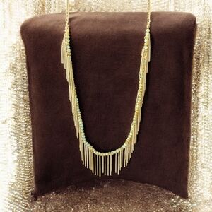 Freedom gold and green long necklace with a boho feeling fringe.